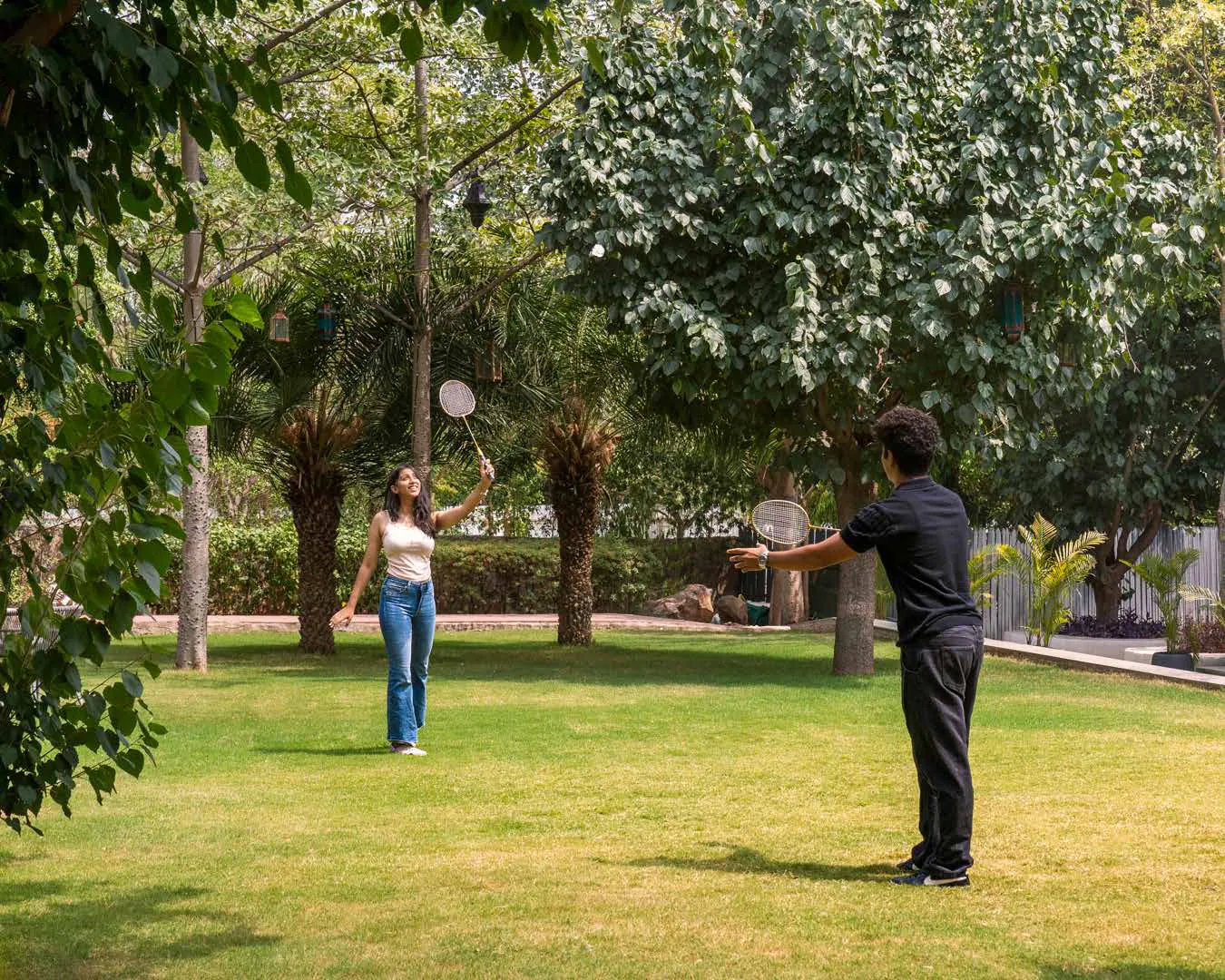 A game of badminton on the Soulkin lawns