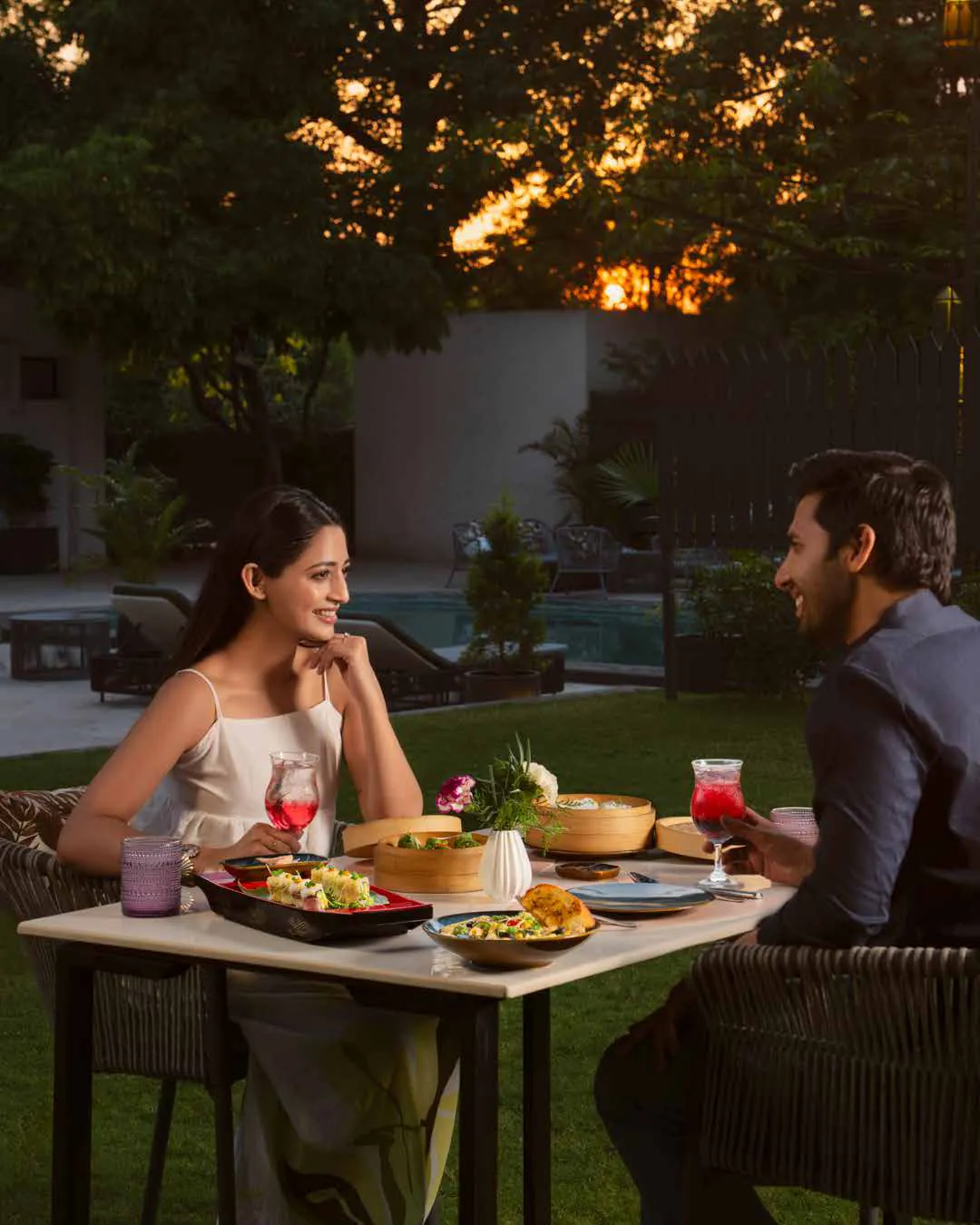 A sunset dinner for two by the pool