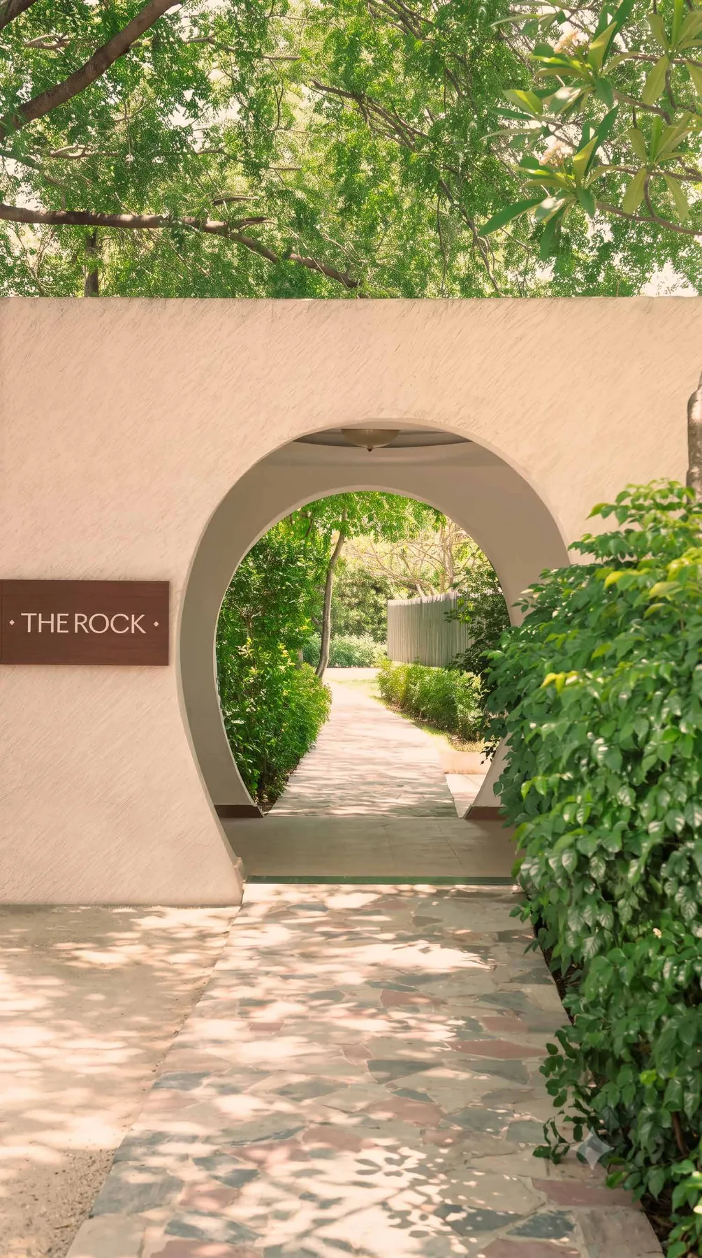A stone archway opening onto the green grounds of Soulkin